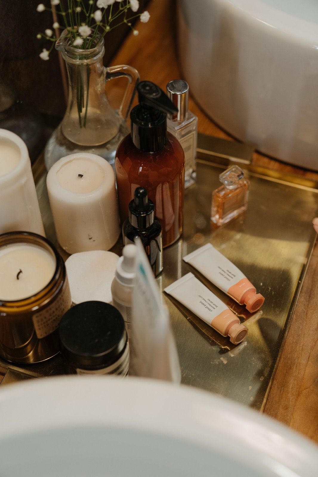 A lineup of skincare and makeup products, several nearly empty